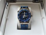 a blue watch in a white box on a table
