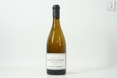 a bottle of wine that is sitting on a table