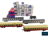 a lot of train cars that are sitting next to each other