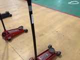 two jacks that are sitting on the floor in a gym