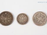three different types of coins are shown on a white surface