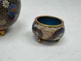two vases sitting next to each other on a table
