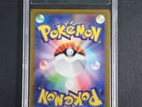 a close up of a pokemon card on a black surface