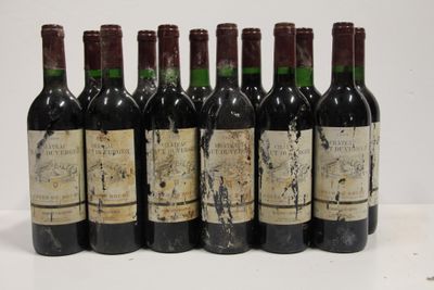 six bottles of wine are lined up in a row