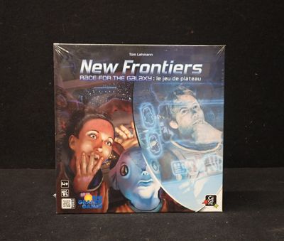 a box of new frontiers on the table