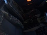 a car that has a steering wheel and a seat in it