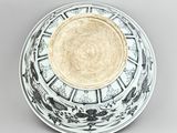 a white plate with a black and white design on it