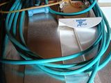 a hose that is sitting on the floor next to a box