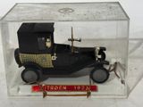 a small model of a car in a clear box