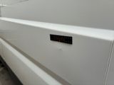 a white van with a black sticker on the side of it