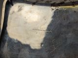 a close up of a piece of metal with a black and white design