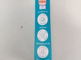 a box of toothpaste on a table with a tooth brush