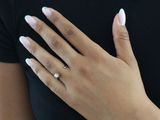 a woman with a ring on her finger and a ring on her hand
