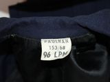 a label on the back of a black jacket