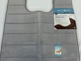 a close up of a bath mat with a tag on it