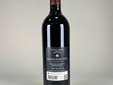 a bottle of wine that is sitting on a table