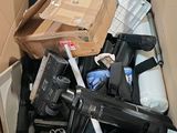 a cardboard box full of assorted items in it