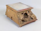 a small wooden box with a marble top on a white surface
