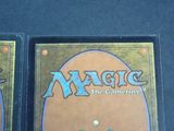 two decks of magic the gathering are shown on a table