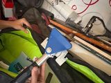 a man that is holding a tool in a bag