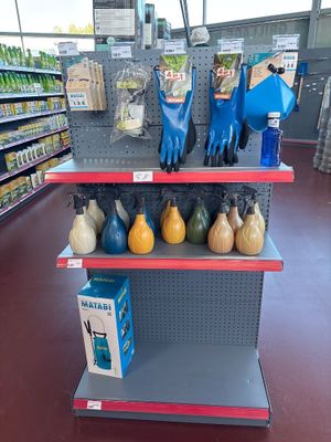 a display of gardening tools on the shelves in the store