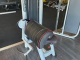 a gym room with a bench, weights, and other equipment