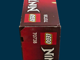 a box of legos sitting on a blue surface