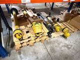 many different types of pipes on a pallet in a warehouse