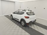the white car is parked in the garage on the checkered floor