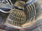 a picture of the inside of a car with leather seats