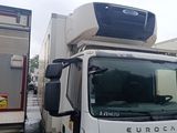 a white truck that is parked next to a white truck