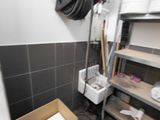 a small room with a lot of boxes and a hose