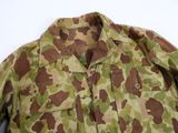 an image of a camouflage jacket on a white background