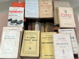 a lot of books that are sitting on top of a table