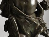 a statue of a woman holding a baby on her lap