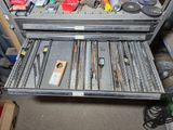 a metal tool case with many different tools in it