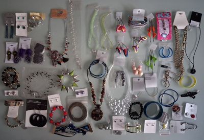 a lot of jewelry on the table together on the table