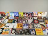 a table with a lot of different album covers on it