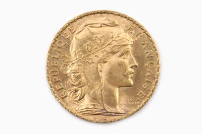 l'image d'une pièce d'or sur laquelle figure une tête de femme