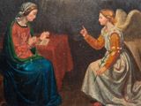 an image of a painting of an angel and a woman sitting at a table