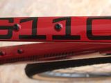 a close up of a red bike with the number 6110 on it