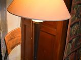a lamp that is sitting on a table in a room
