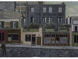 painting of a man walking down the street in front of a building