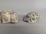 pair of carved ivory figurines of a woman ' s head and a man ' s head