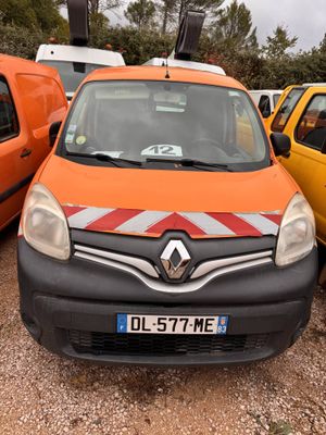a small orange van parked next to a yellow van