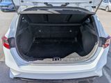 a trunk of a white car with its trunk open