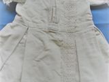 an image of a white dress on a blue background