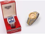 an image of a couple of watches sitting next to each other