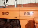 a close up of an orange tractor with a number on it