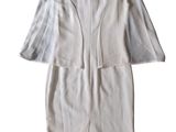 the back of a white dress with a long jacket on a mannequin mannequin mannequin mannequin mannequin mannequin manne